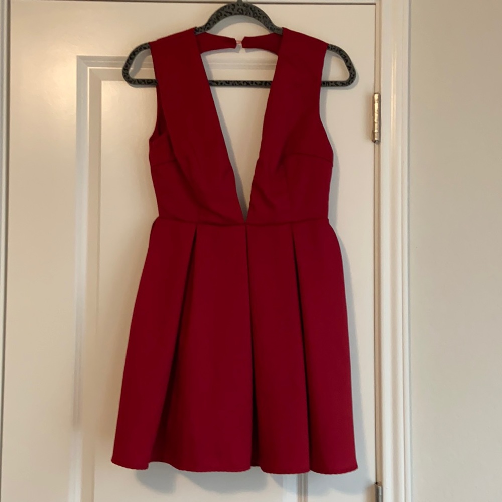 ANGL red Cocktail dress. Pleated front. Open back. Deep plunging V neck. Mini.